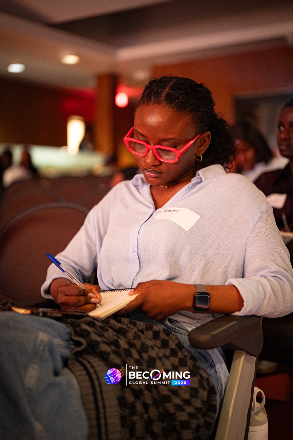 A participant takes notes during the Becoming Global Summit 2026.